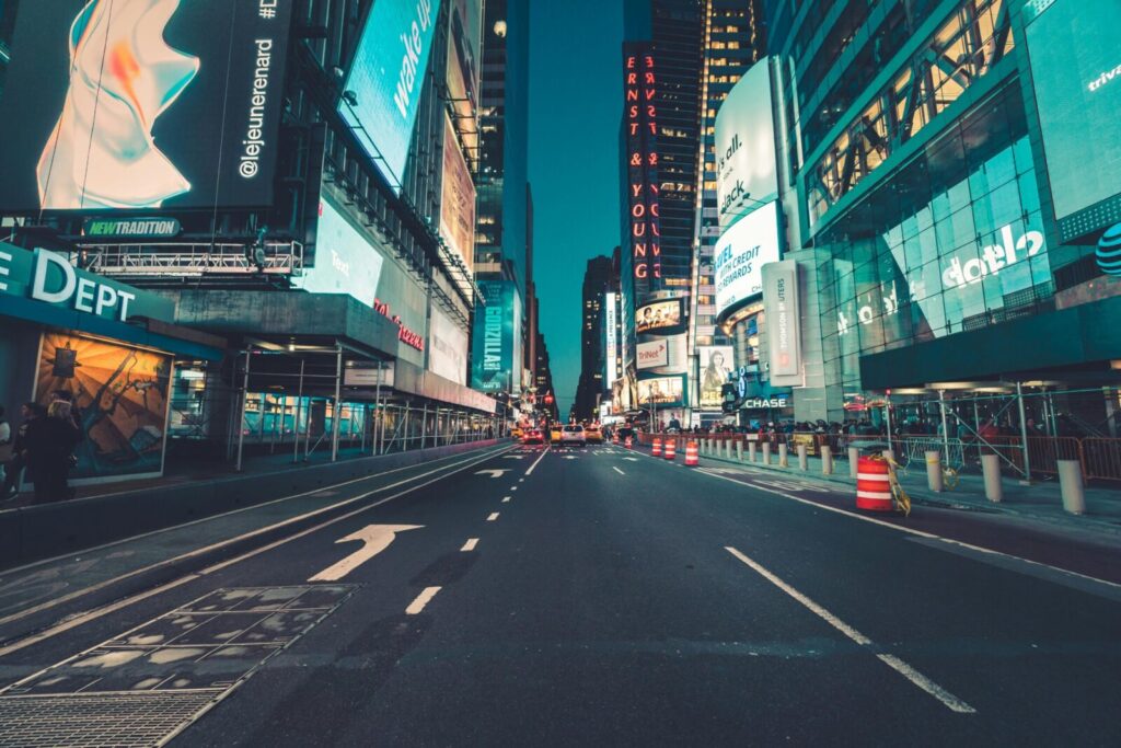 A dynamic evening view of illuminated Times Square, New York City, showcasing urban life.